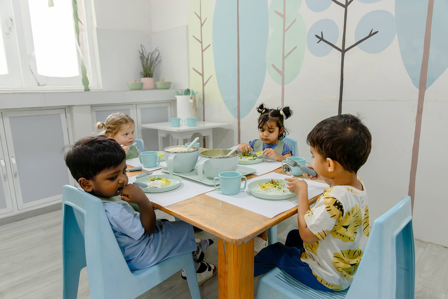 Children enjoying snack time at The American Preschool, Colombo