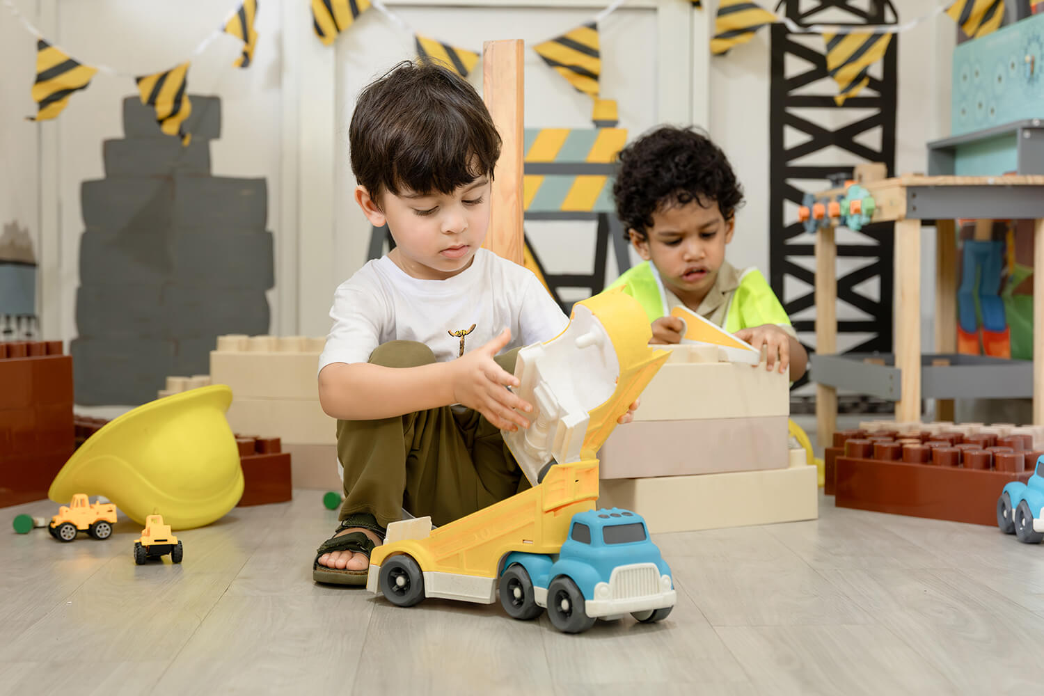 Children engaged in pretend play construction at The American Preschool, Colombo